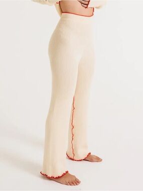 Wide-Leg Cream Ribbed Knit Pants with Red Lettuce Edge